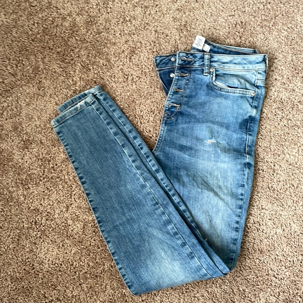 Ripped button fly jeans